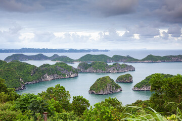 beautiful limestone rocks and secluded beaches in Ha Long bay, UNESCO world heritage site, Vietnam