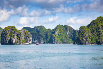 beautiful limestone rocks and secluded beaches in Ha Long bay, UNESCO world heritage site, Vietnam - 780890430