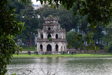 view of the Turtle Tower in middle of the Hoan Kiem Lake (Lake of the Returned Sword) at historic centre of Hanoi in Vietnam - 780891810