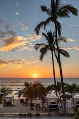Sunset in Mexico at a tropical beach is a travel paradise filled with beautify