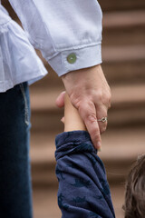 Family members holding hands together in union