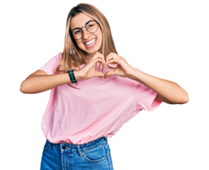 Hispanic young woman wearing casual t shirt and glasses smiling in love showing heart symbol and shape with hands. romantic concept.