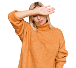 Middle age caucasian woman wearing casual winter sweater covering eyes with arm, looking serious and sad. sightless, hiding and rejection concept