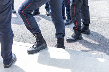 Typical shoes of italian carabinieri police officers. Leather shoes on feet of police unit in...