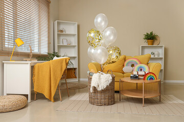 Basket with balloons and toys rainbow at home © Pixel-Shot