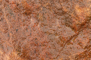Relief uneven texture of wet rock stone. Abstract background