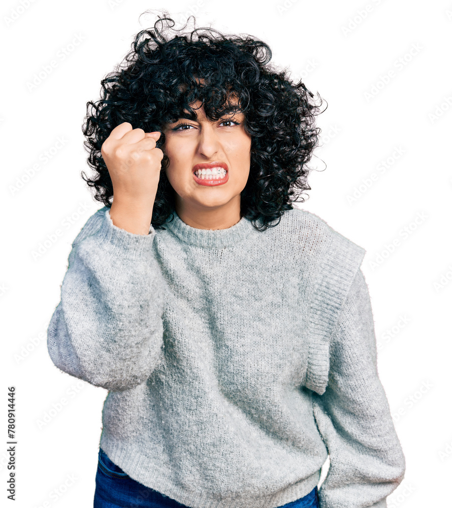 Canvas Prints young middle east girl wearing casual clothes angry and mad raising fist frustrated and furious whil