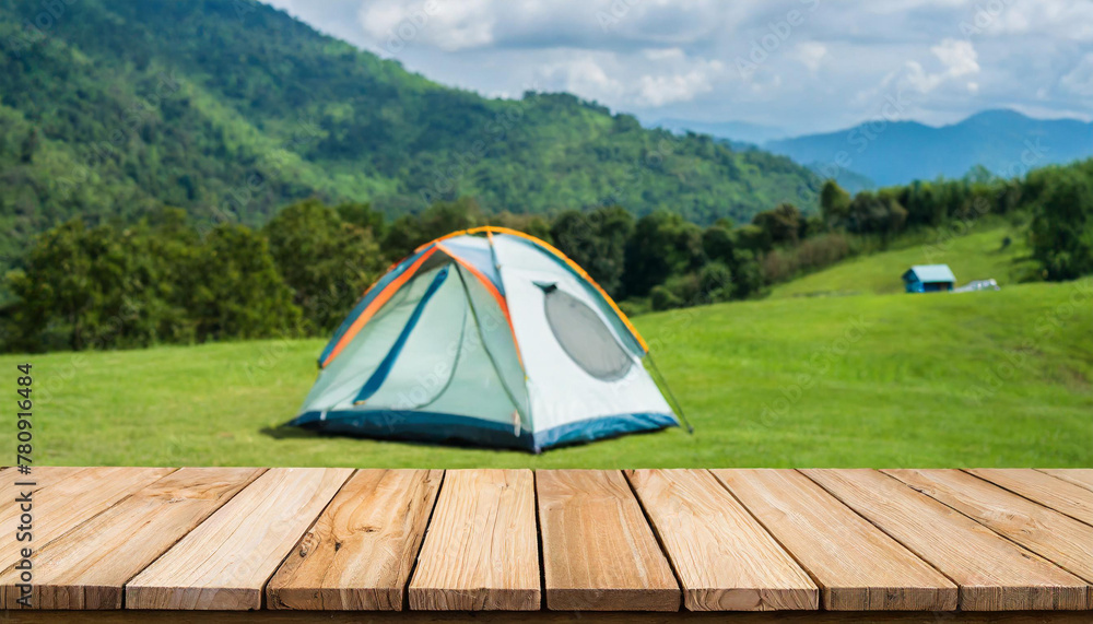 Poster wooden table top on blur tent camping travel tent and grass field. fresh and relax concept. for mont