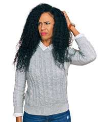 Middle age african american woman wearing casual clothes confuse and wondering about question....