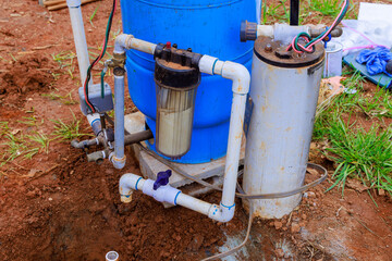 Plumber connects water to well pump with an underground pipeline for new home