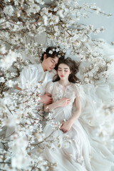 Lovers nestled among spring blossoms
