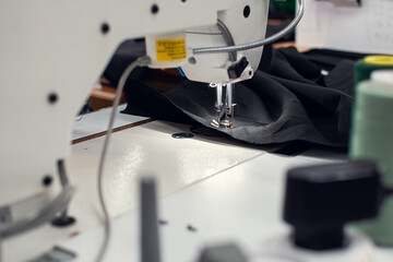 Close-up stitching process on a sewing machine.