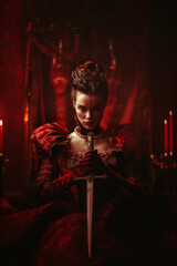 Regal woman in red with a sword