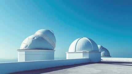 Fototapeta na wymiar Majestic Astronomical Observatory with Iconic White Domes Against Serene Blue Sky