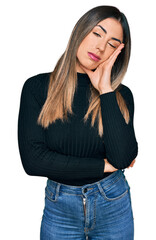 Young hispanic woman wearing casual clothes thinking looking tired and bored with depression problems with crossed arms.