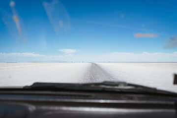 Point of view from car of Salar de Uyuni salt flats in Bolivia