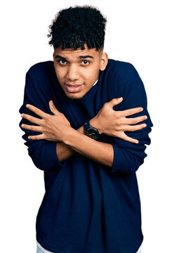 Young african american man wearing casual clothes shaking and freezing for winter cold with sad and shock expression on face