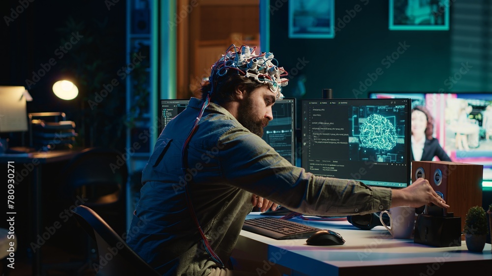 Poster engineer with eeg headset inserting cartridge into pc to use high tech software allowing for brain t