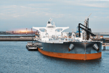 Very Large Crude Oil Carrier Tanker In The Trade Port During Bunkering Fuel Operations.