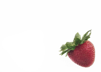 Whole strawberry on a white background with copy space