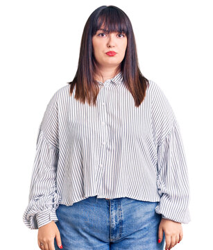 Young plus size woman wearing casual clothes depressed and worry for distress, crying angry and afraid. sad expression.