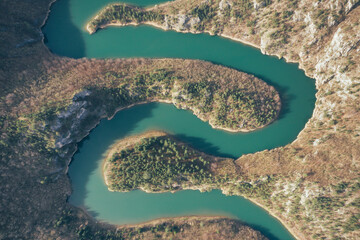Aerial view of mountain river meanders