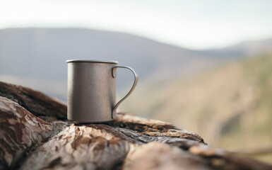 Camping mug on the wood, copy space