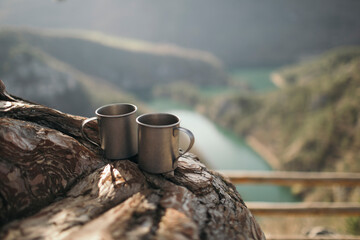 Two camping mugs on the viewpoint