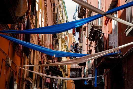Clothes traditionally dry on lines between balconies in Naples, Italy.