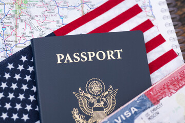 United States of America Passport and Visa on US Flag background. concept of obtaining US...