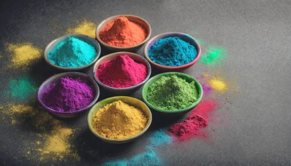 top view of colorful traditional holi powder in bowls on grey background happy holi copy space the concept of the indian festival of colors