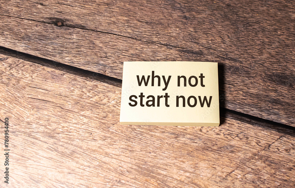 Poster text why not start now on sticky notes with copy space and paper clip isolated on red background.