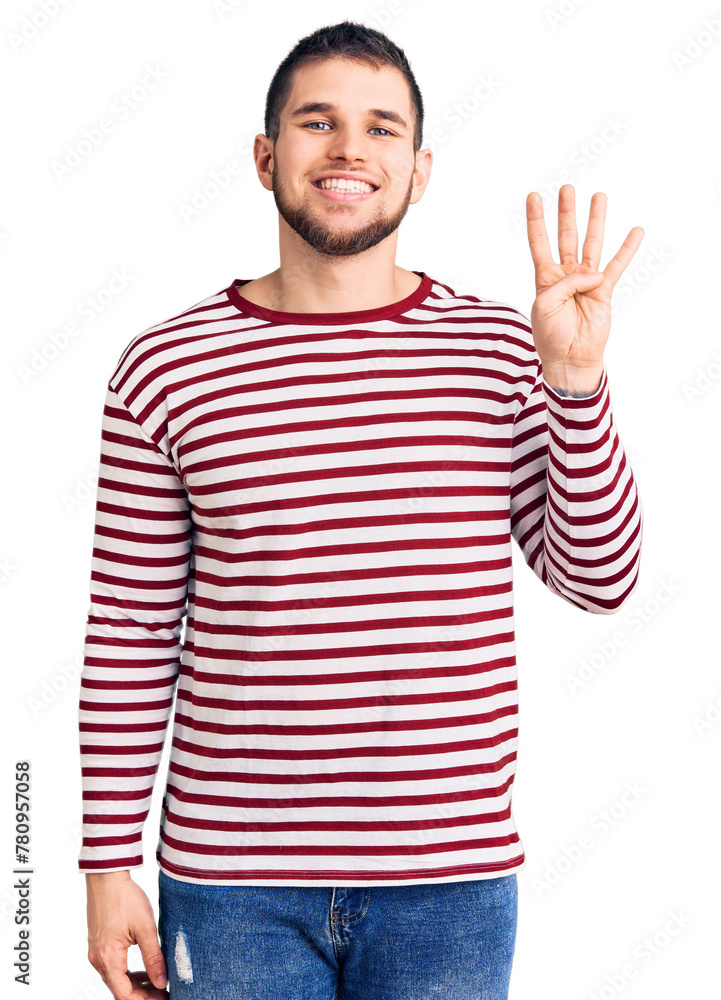 Sticker Young handsome man wearing striped sweater showing and pointing up with fingers number four while smiling confident and happy.