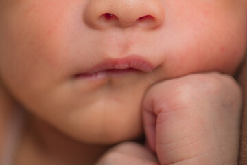 Little newborn baby chin and lips