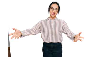 Young hispanic girl wearing casual clothes and glasses smiling cheerful offering hands giving assistance and acceptance.