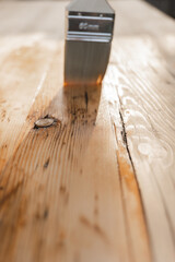  Impregnation of a wood with protective oil.Protecting the wooden surface from damage. Oil and...