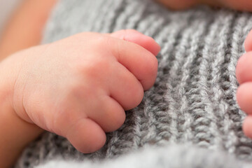 Little newborn baby hands 