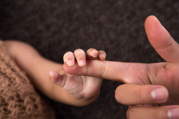 Little newborn baby hands 
