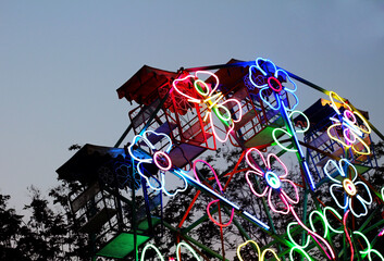 Beautiful of ferris wheel at temple fair night