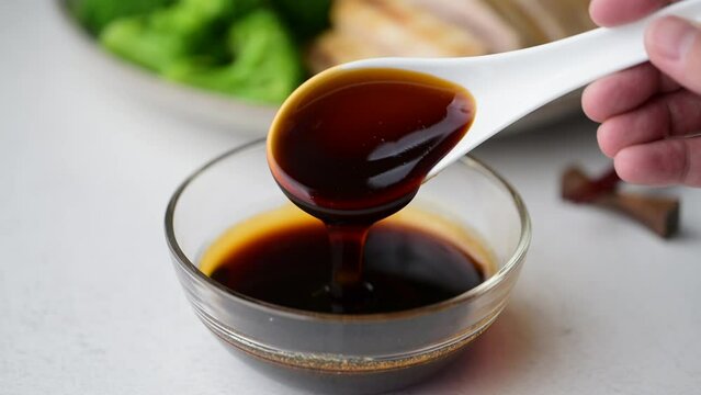 scooping up sticky teriyaki sauce
