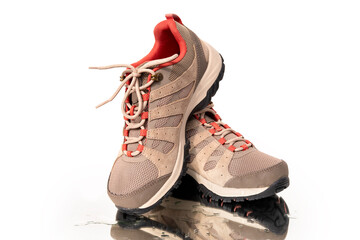 pair brown comfortable New trekking sneakers, waterproof hiking boots with laces on wet mirror with...