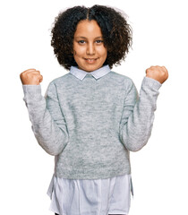 Young little girl with afro hair wearing casual clothes celebrating surprised and amazed for...