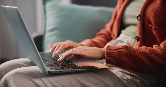 Sofa, hands or writing on laptop to search, ux or technology on news, website or social media. Freelance writer, woman or typing of proposal, idea or script as creative development in remote work