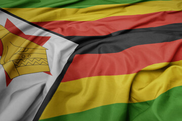 waving colorful national flag of zimbabwe.