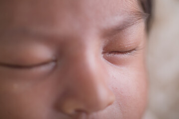 Newborn baby closed clse up eye