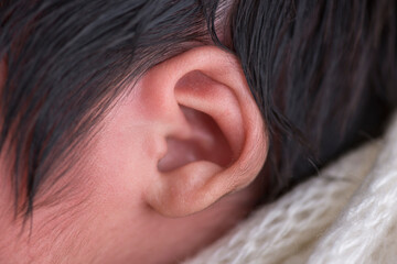 Close up macro photography of a newborn baby ear person attention listen - obrazy, fototapety, plakaty