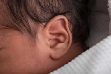 Close up macro photography of a newborn baby ear person attention listen