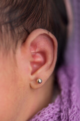 Close up macro photography of a newborn baby ear person attention listen