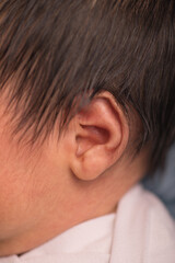 Obraz premium Tiny newborn baby ear body part listen 