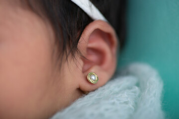 Tiny newborn baby ear body part listen 